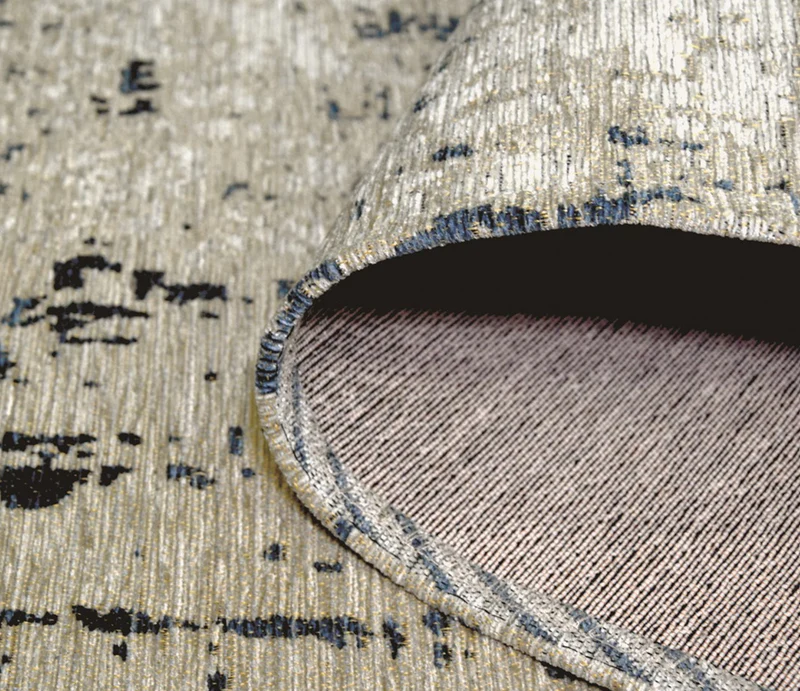 Tapis salon beige tacheté bleu - Antik Cloud